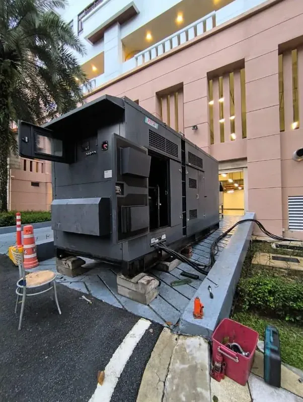 Temporary generator installed beside a healthcare facility